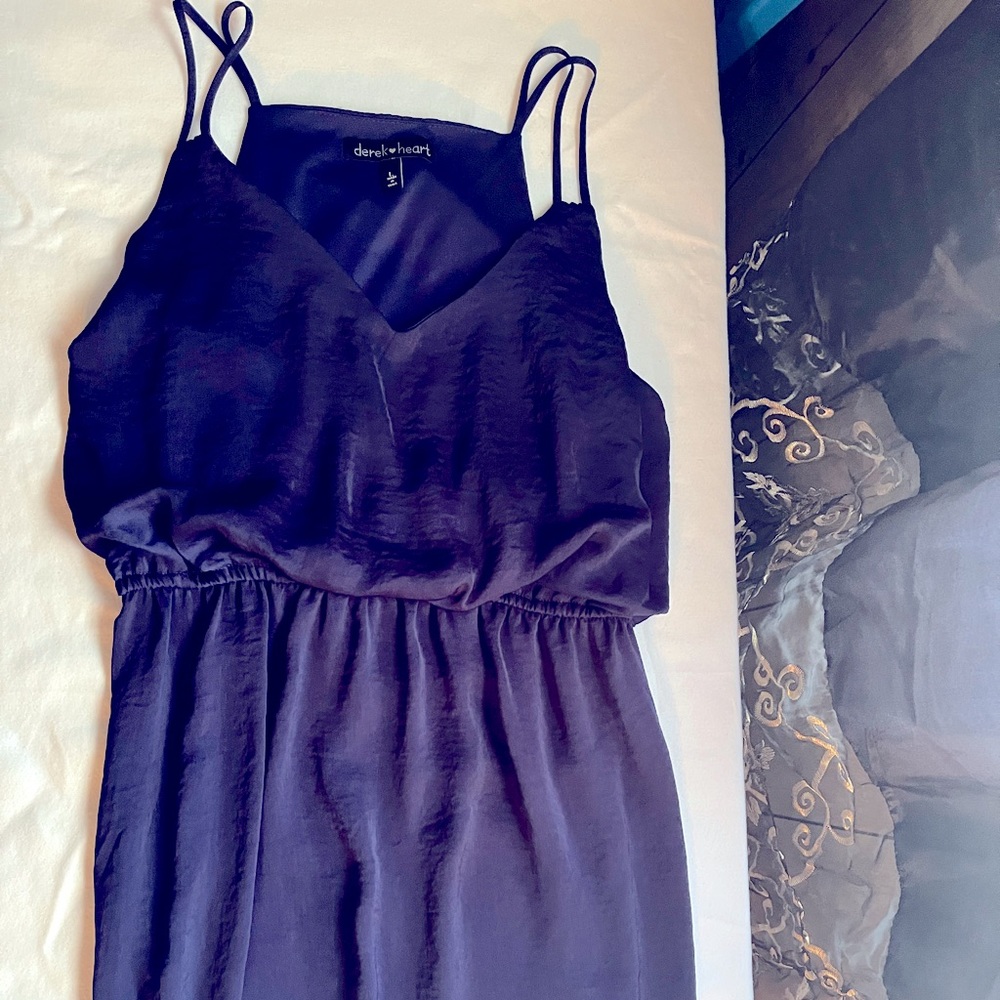 Strappy blue dress. Medium in size .Definitely can go casual or pair a jacket .